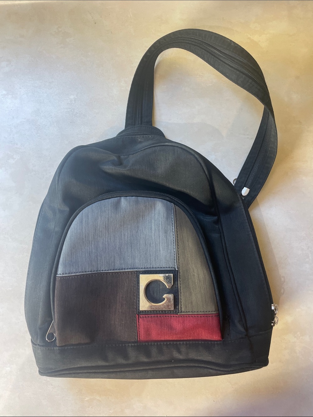 Women’s Black Multi-Panel Sling Bag Backpack with Accent Patch